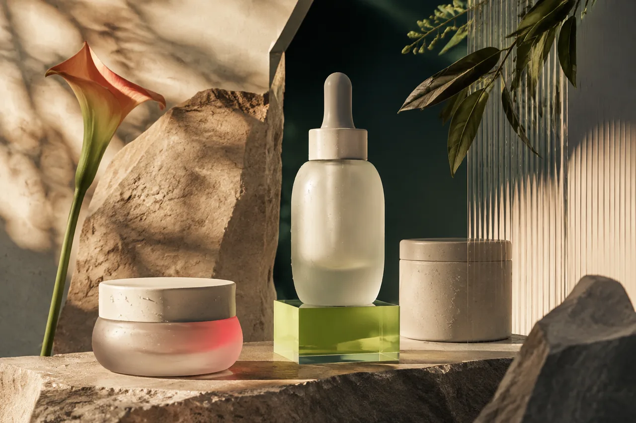 Unbranded skincare bottles arranged in a warm editorial product scene